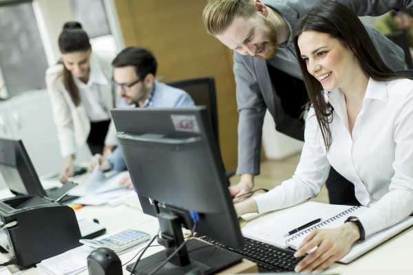 Business people working in a busy office