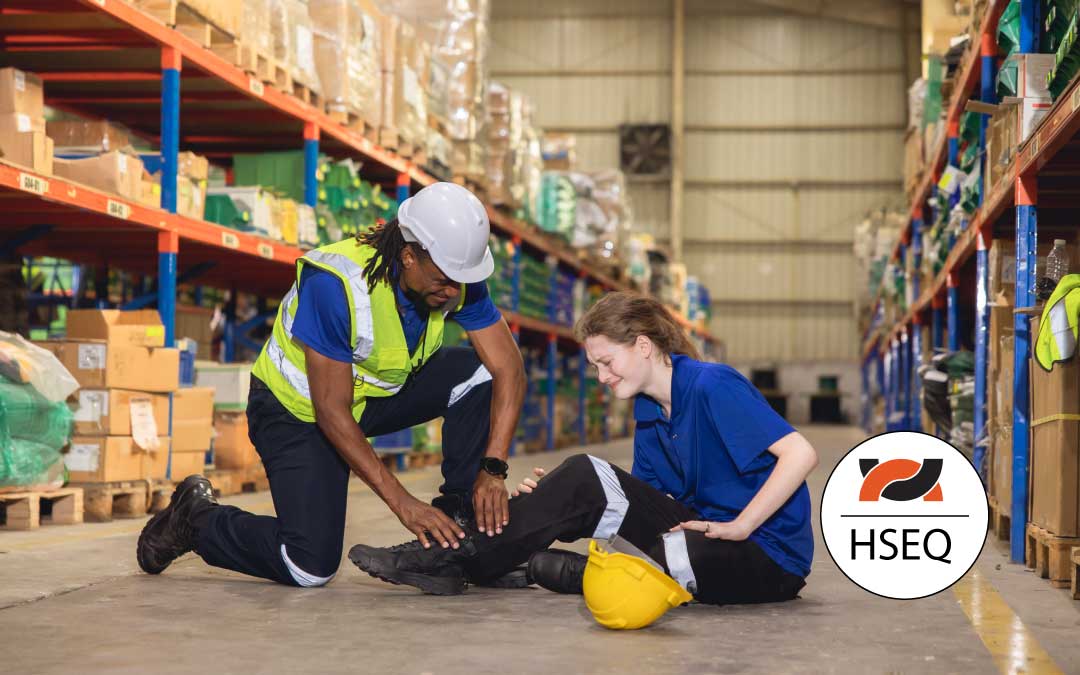 Young woman warehouse worker with an accident leg injury